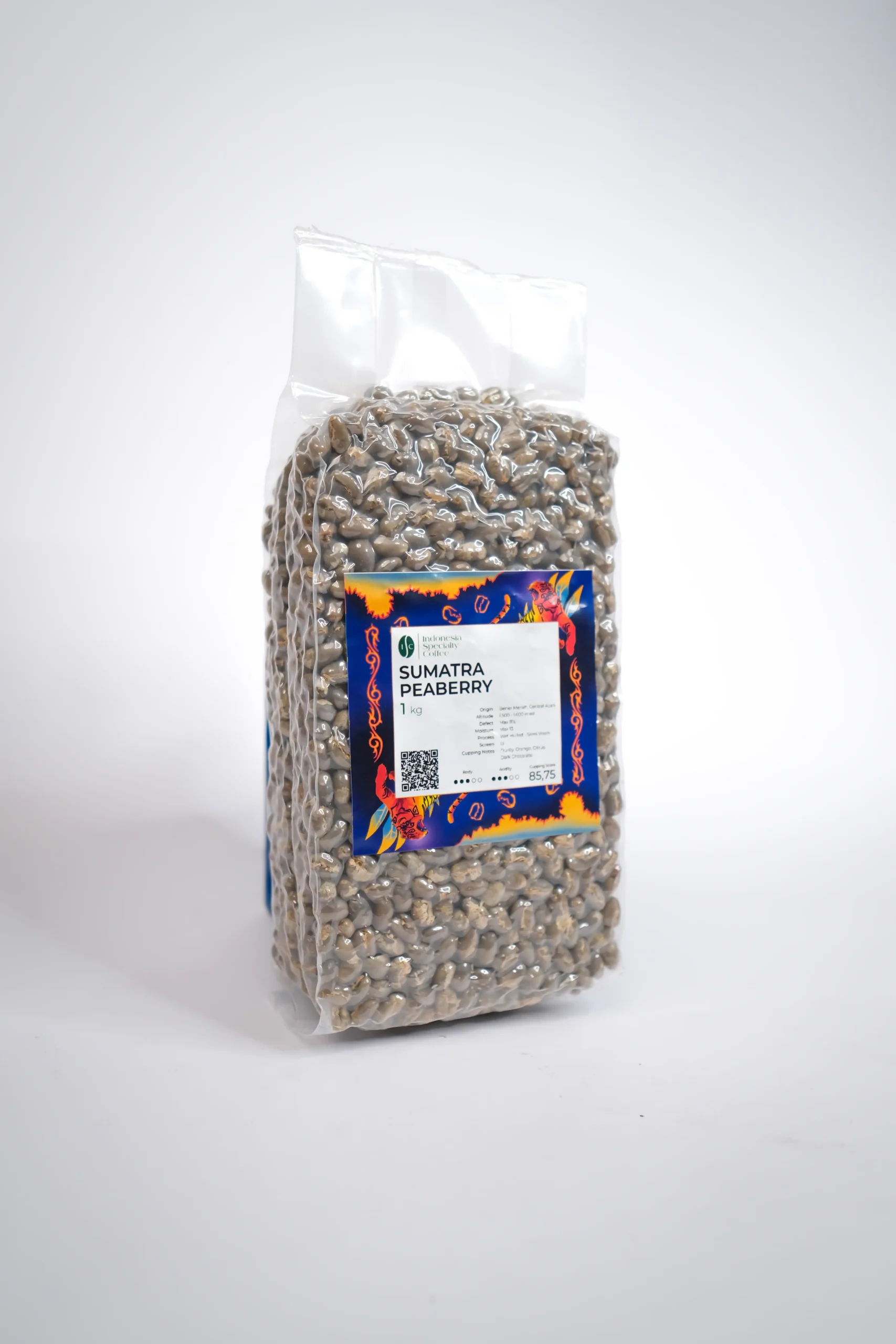 Sumatra Peaberry coffee beans, showcasing their unique round shape and rich, dark color, ready for brewing.