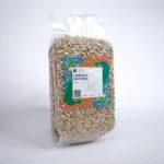 A handful of Liberica coffee beans, emphasizing their irregular shape and shiny exterior, set against a rustic wooden surface.