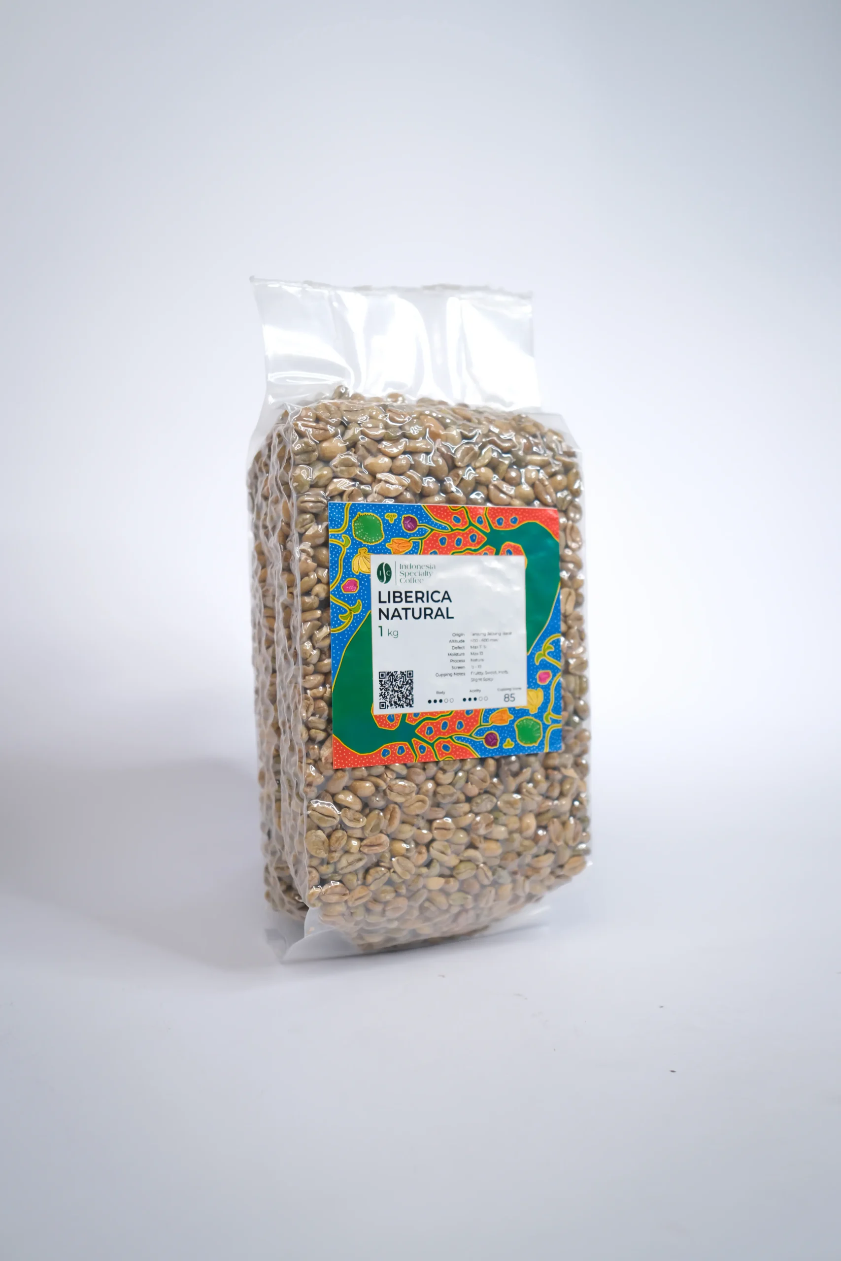 A handful of Liberica coffee beans, emphasizing their irregular shape and shiny exterior, set against a rustic wooden surface.