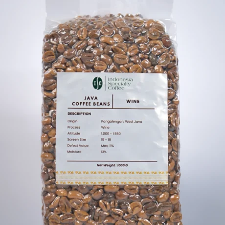 A steaming cup of coffee with a rich, dark color, surrounded by coffee beans and a wine glass in the background.